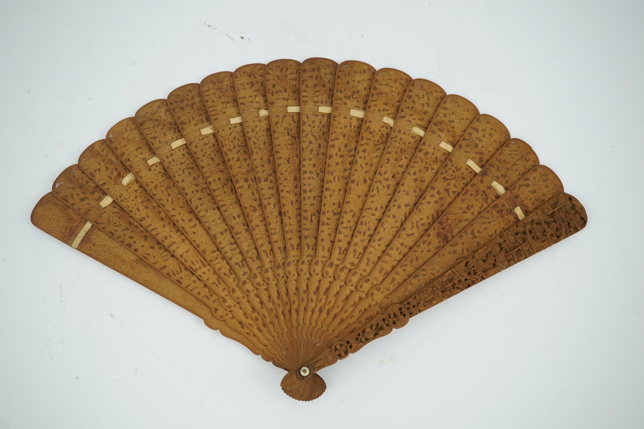 A fine Chinese sandalwood brise fan with finely carved sticks and guards, together with a mid 20th century silk calligraphic poetry LuYou fan, brise fan 38cm wide. Condition - minute damage to carving on one stick, sanda